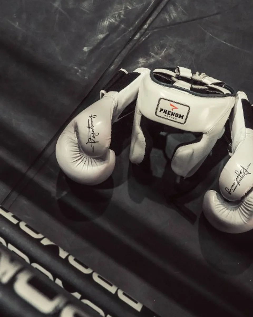 Boxing gloves and headgear in the corner before a bout